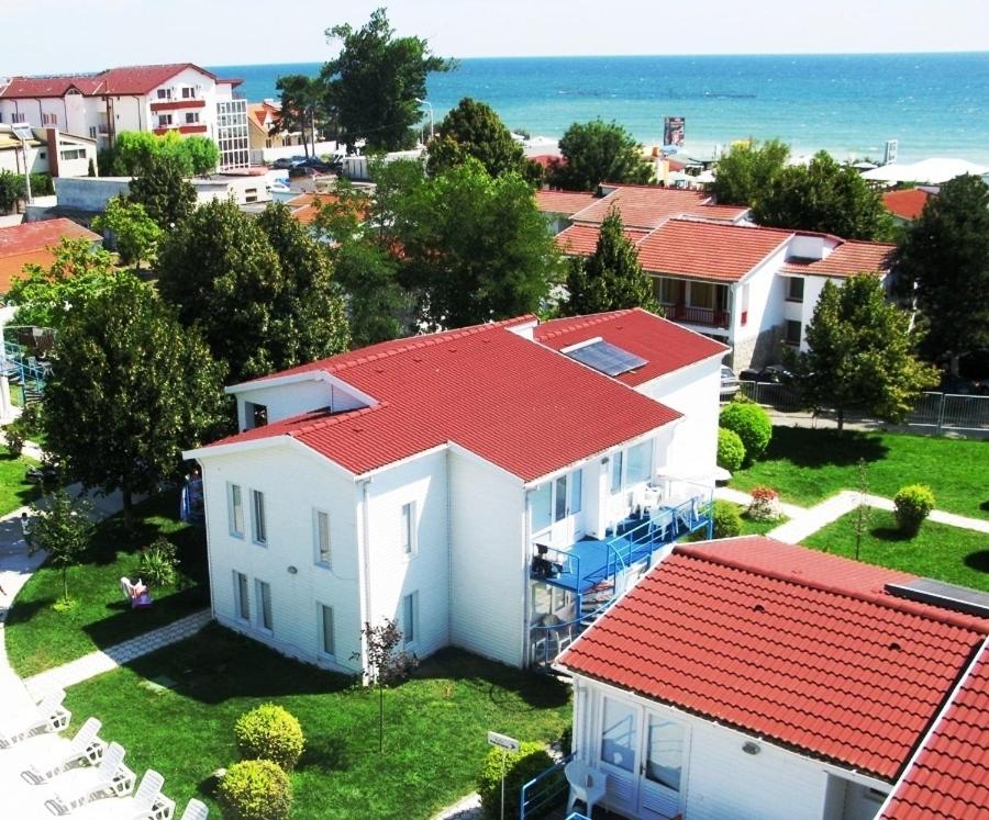 an aerial view of a white house with a red roof at Complex Credo in Costinesti