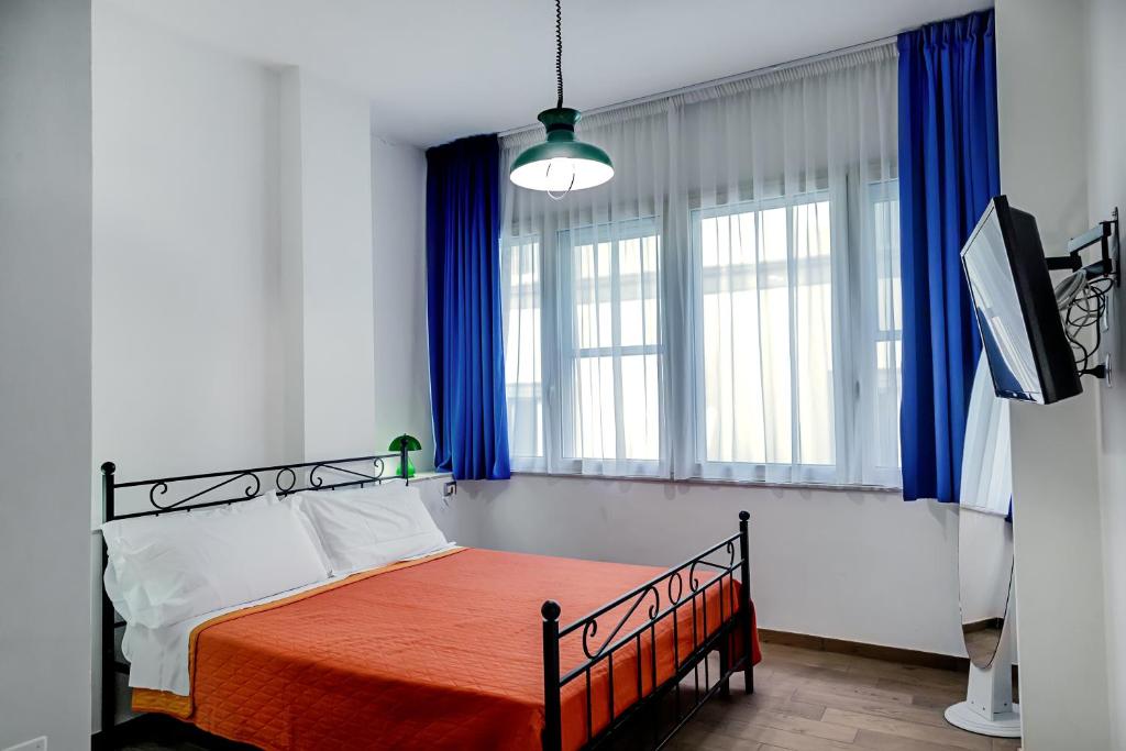 Łóżko lub łóżka w pokoju w obiekcie 1970 Rooms