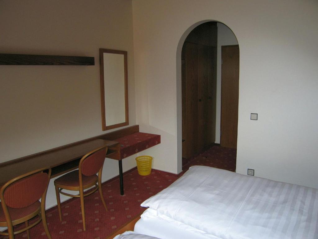 Postel nebo postele na pokoji v ubytování Hotel Bräukeller