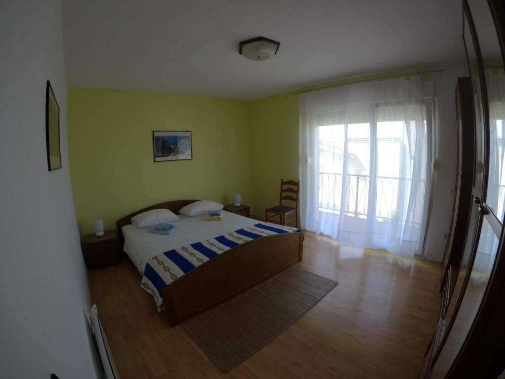 Posteľ alebo postele v izbe v ubytovaní Apartman Kalajžić