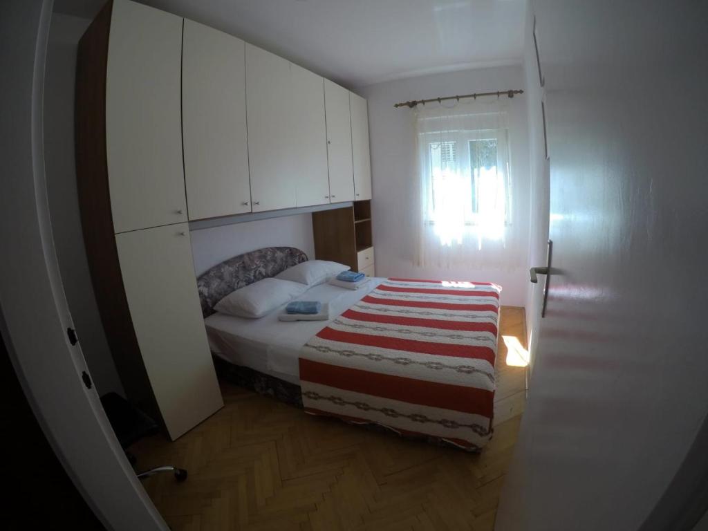 Posteľ alebo postele v izbe v ubytovaní Apartman Kalajžić