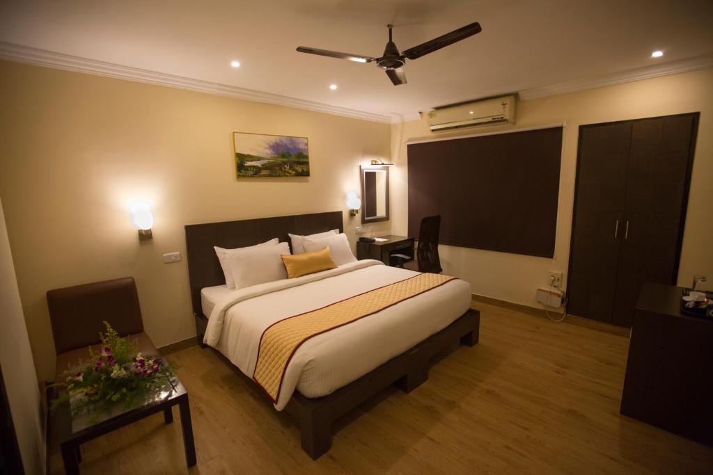 Voodi või voodid majutusasutuse Hotel Ashok Residency toas