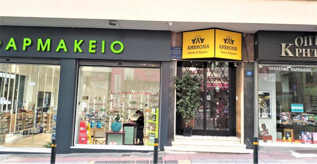 a store front of a store with signs on it at Ambrosia Suites in Athens