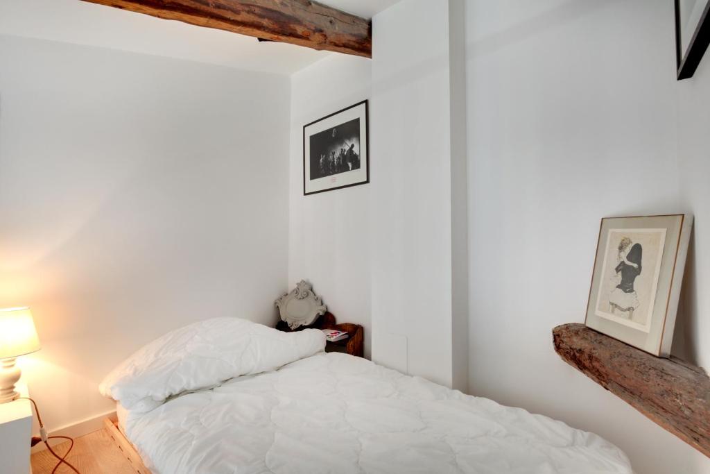 Łóżko lub łóżka w pokoju w obiekcie San Marcuola apartment