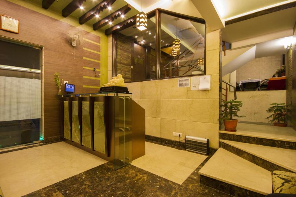a lobby with a elevator in a building at Hotel Sunstar Heights in New Delhi