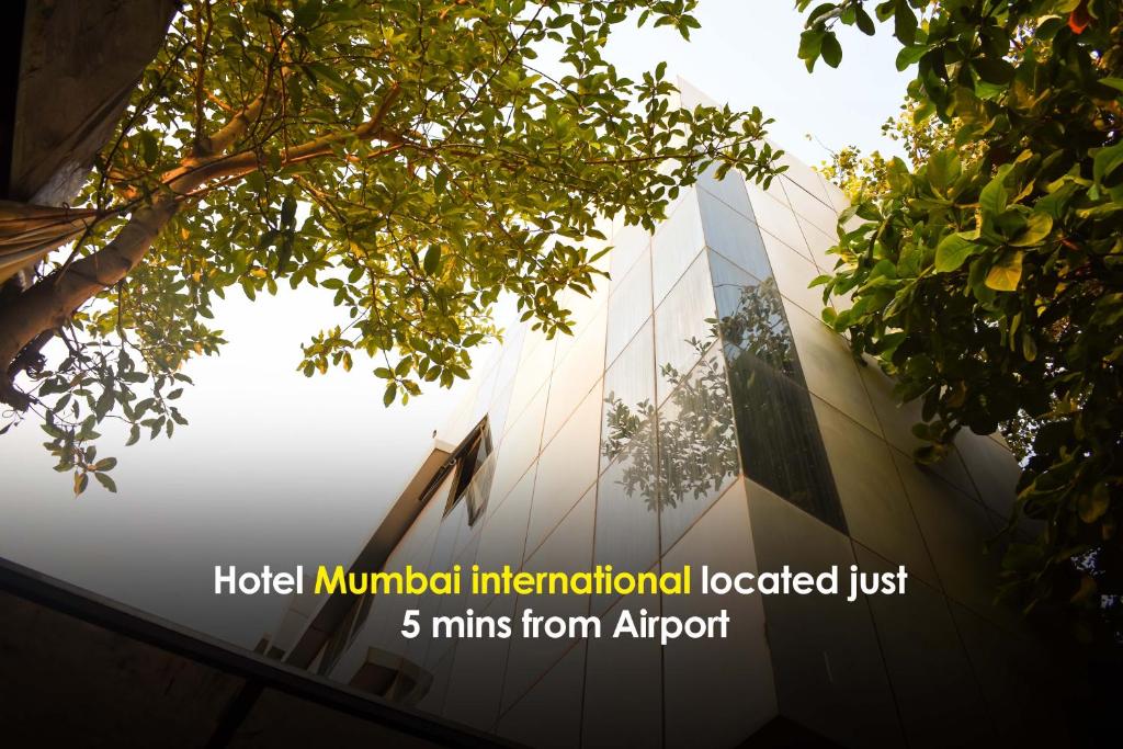a building with the words hotel municipal international located just mins from airport at Hotel Mumbai International- Near T2 International Airport in Mumbai