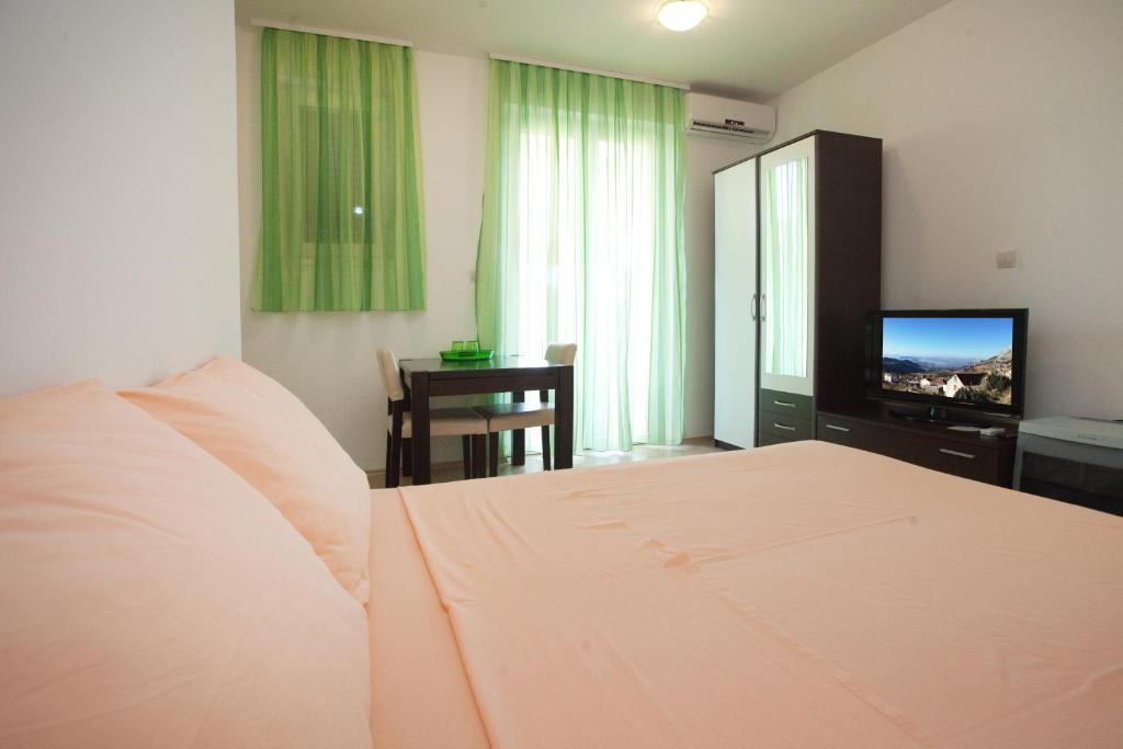Postel nebo postele na pokoji v ubytování Apartments Klara