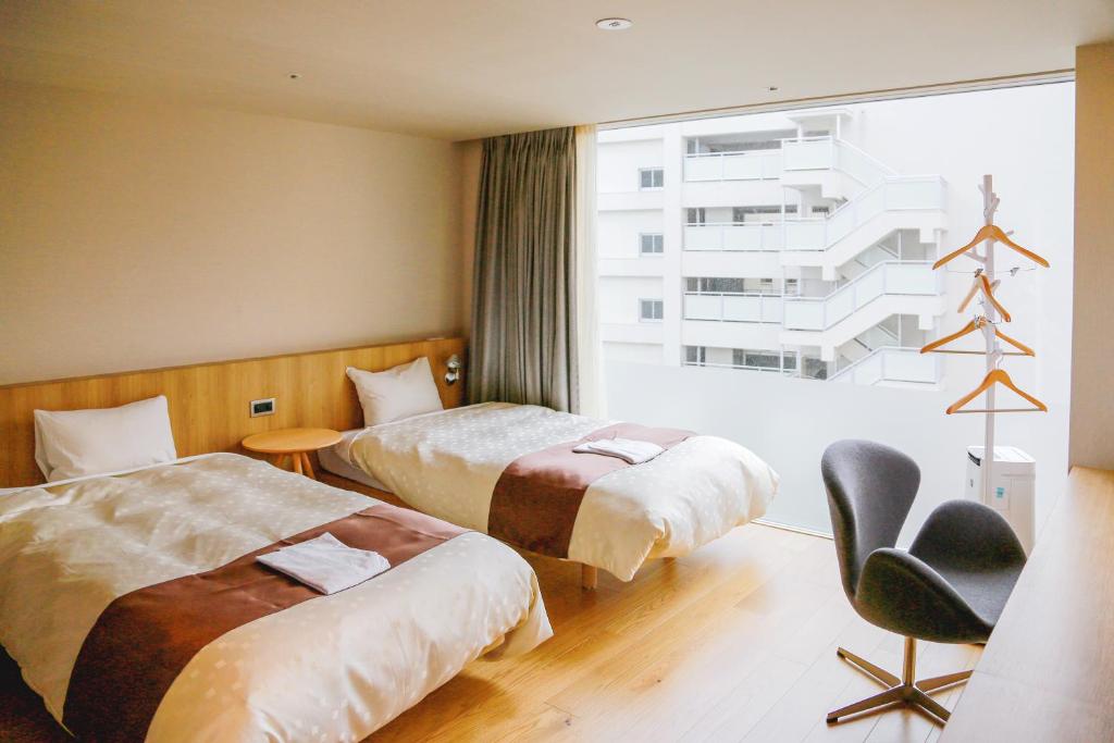 Postel nebo postele na pokoji v ubytování Hotel Comfact
