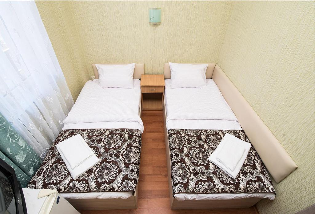 Postel nebo postele na pokoji v ubytování HOTEL ЗiРКА