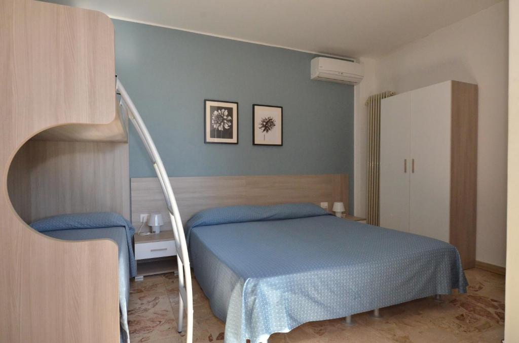 Uma cama ou camas num quarto em Albergo Della Torre