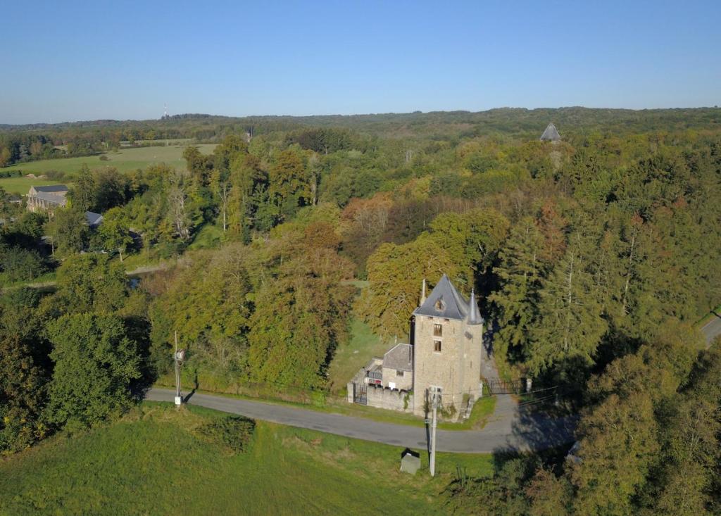an aerial view of an old house on a road at La Tour de Serinchamps in Serinchamps