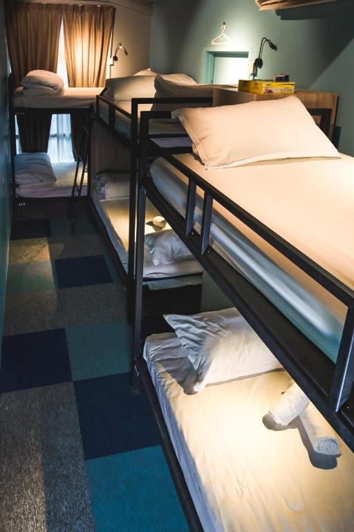 Postel nebo postele na pokoji v ubytování Vibrant Hostel