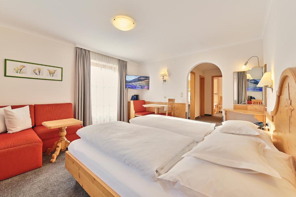 Postel nebo postele na pokoji v ubytování Hotel Bianca