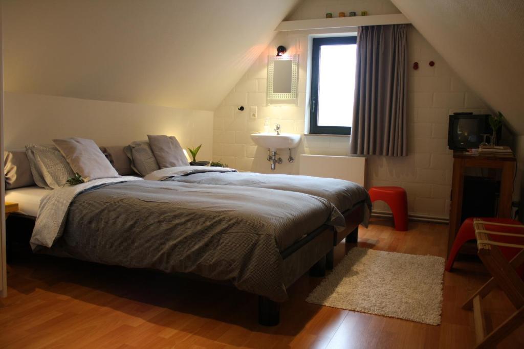 Postel nebo postele na pokoji v ubytování B&B De Kastanjeboom