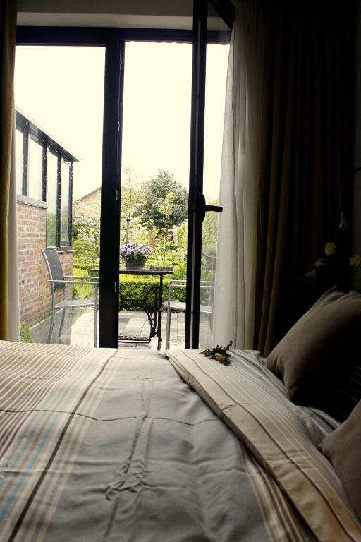 Postel nebo postele na pokoji v ubytování B&B De Kastanjeboom