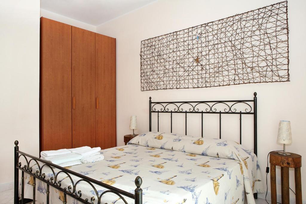 Posteľ alebo postele v izbe v ubytovaní Adriana casa vacanze mare Etna Sicilia