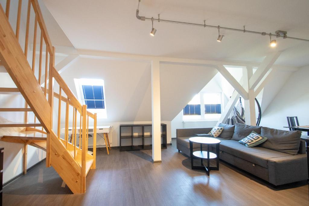 a living room with a couch and a table at BITO CAMPUS in Meisenheim