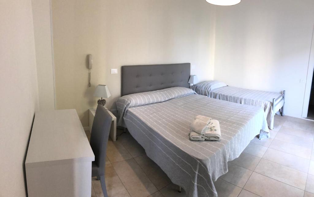 Łóżko lub łóżka w pokoju w obiekcie HOTEL CONDOR