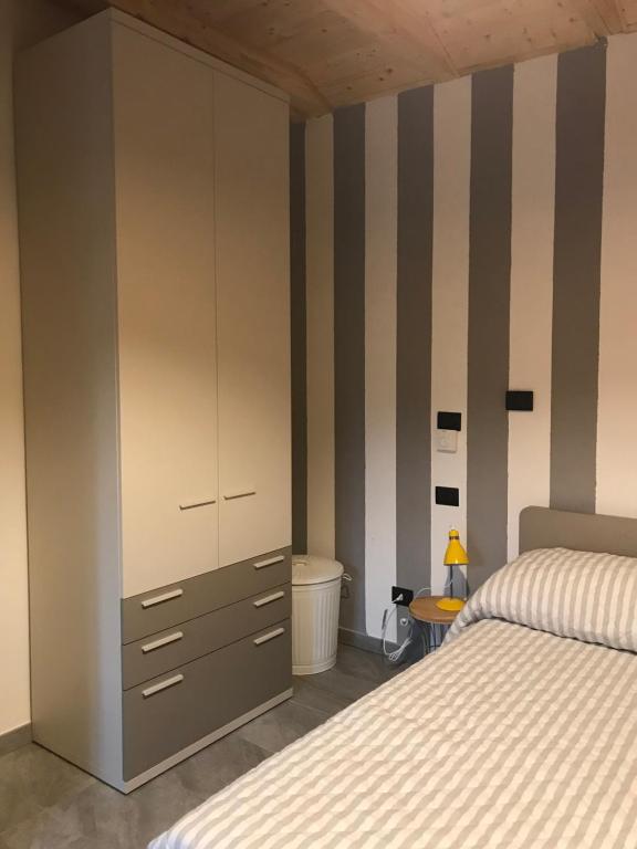 A bed or beds in a room at Il fienile b&b
