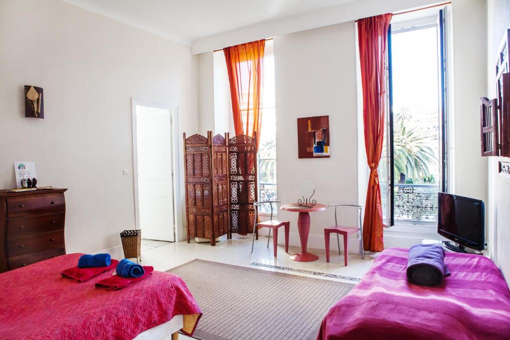 Postel nebo postele na pokoji v ubytování Nice Riviera Sweet Home Chambres d'hotes