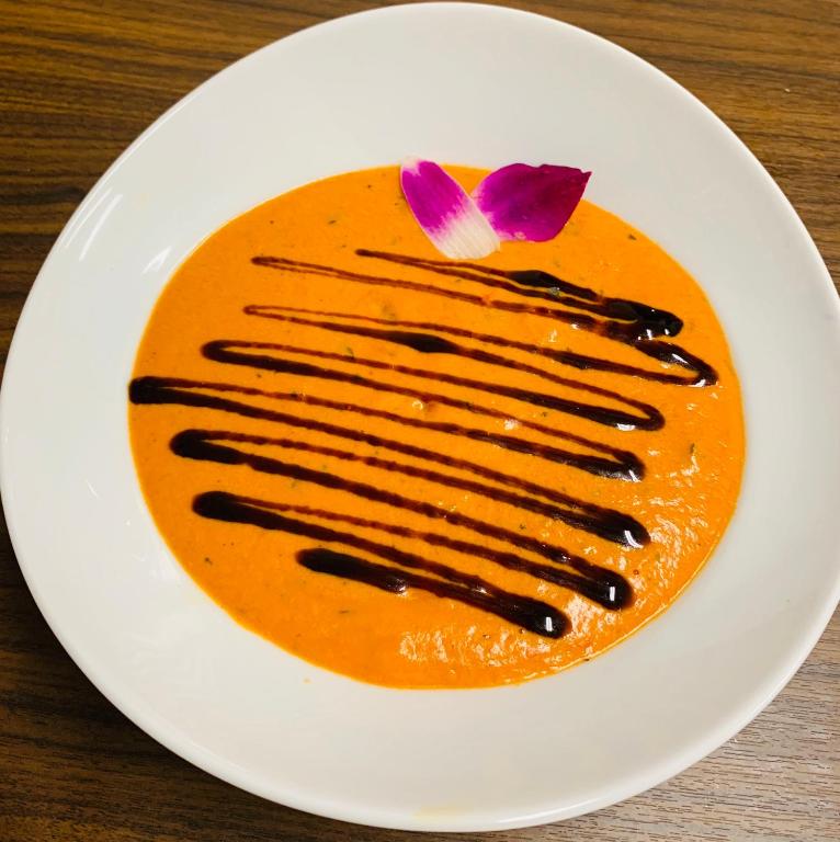 a white plate with a dessert on a table at Wyndham Garden Ft Lauderdale Airport & Cruise Port in Dania Beach