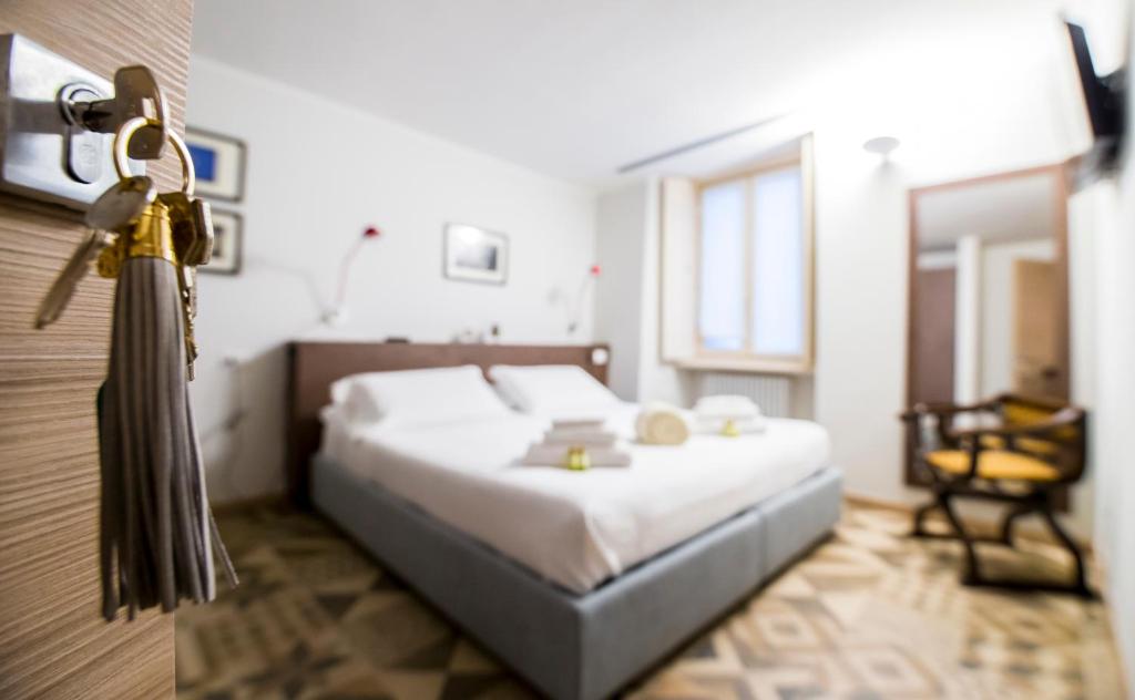 Posteľ alebo postele v izbe v ubytovaní Locanda Mimmo