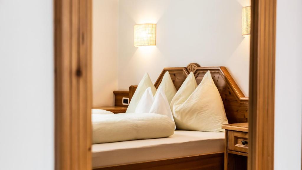 Postel nebo postele na pokoji v ubytování Apartments Chalet Maria