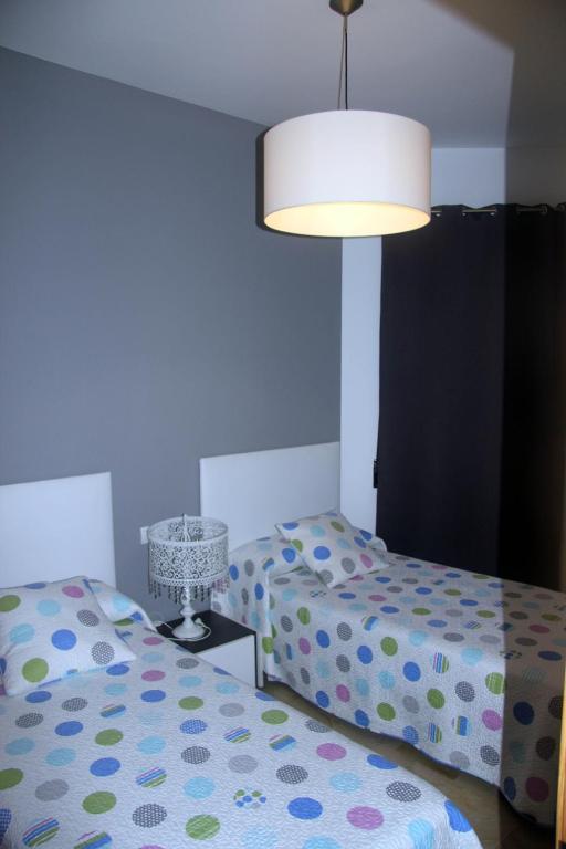 Posteľ alebo postele v izbe v ubytovaní Holiday Apartments Malvarrosa Beach