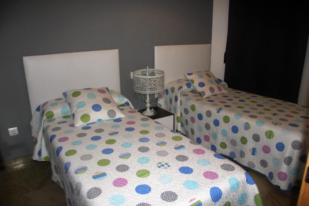 Posteľ alebo postele v izbe v ubytovaní Holiday Apartments Malvarrosa Beach