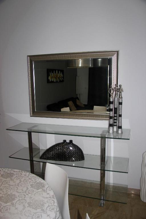 Televízia a/alebo spoločenská miestnosť v ubytovaní Holiday Apartments Malvarrosa Beach