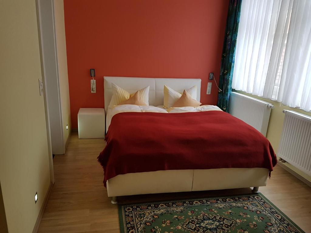 Postel nebo postele na pokoji v ubytování Hotel Am Kuhbogen