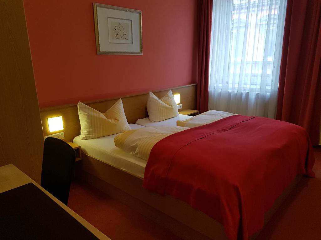 Postel nebo postele na pokoji v ubytování Hotel Am Kuhbogen