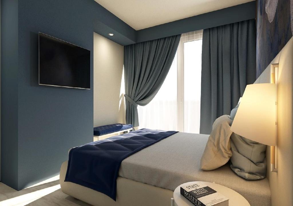 Кровать или кровати в номере Hotel Amburgo
