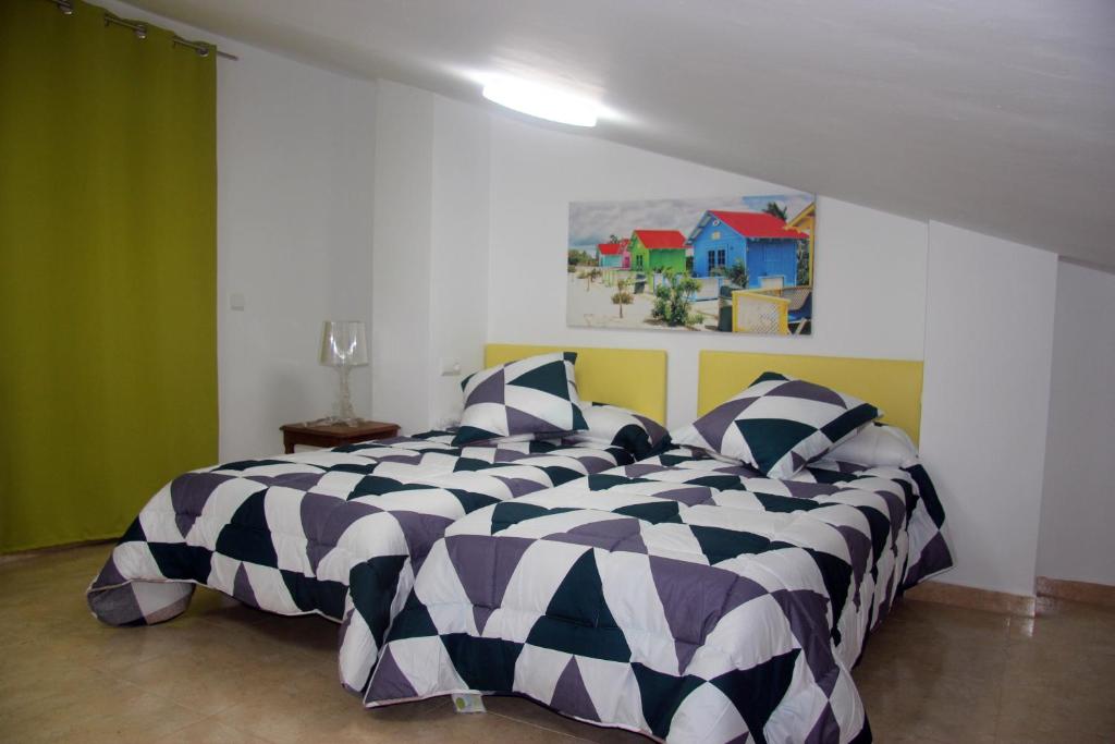 Posteľ alebo postele v izbe v ubytovaní Holiday Apartments Malvarrosa Beach