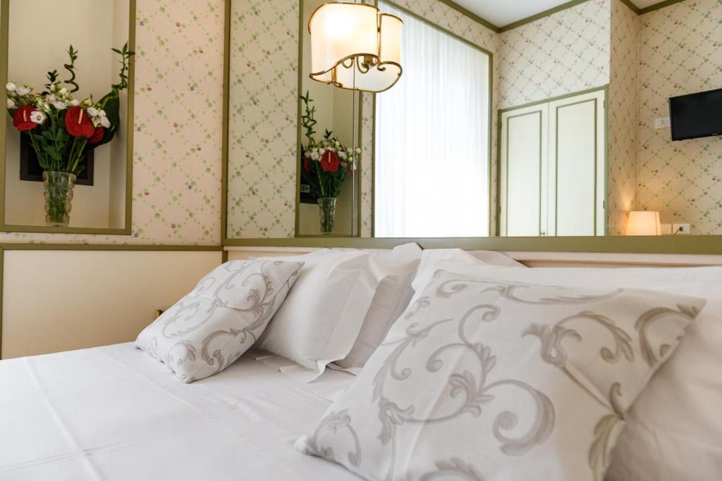 Postel nebo postele na pokoji v ubytování Hotel Continental