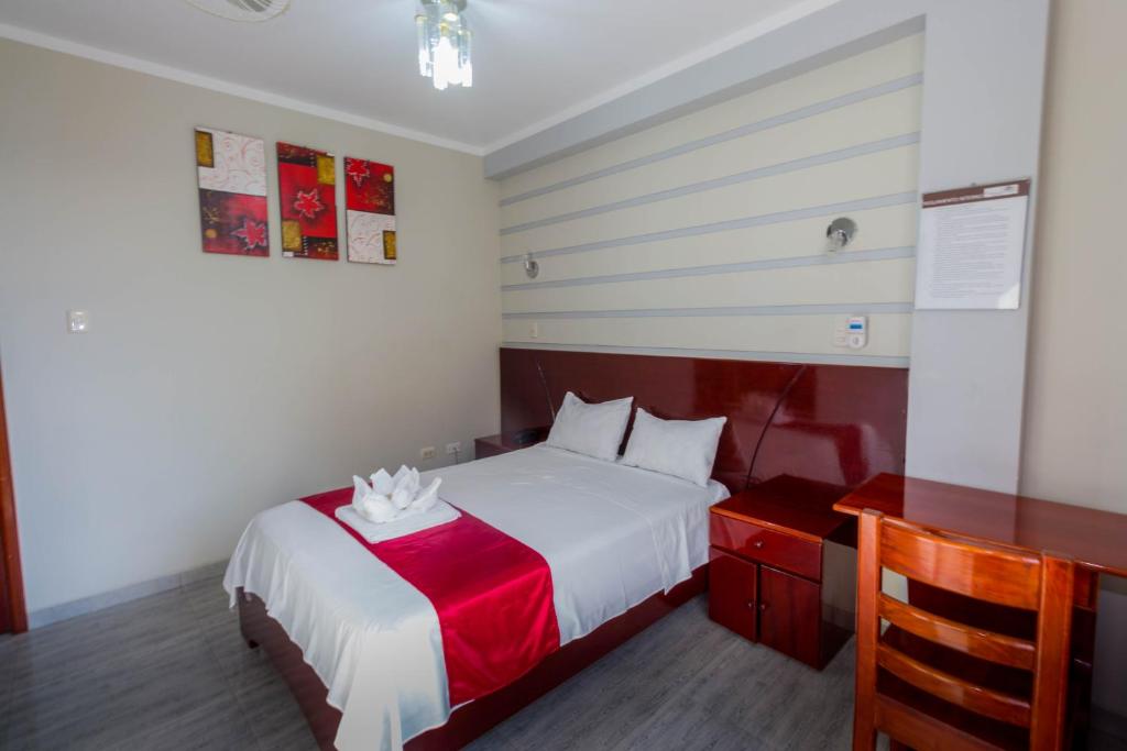 Postel nebo postele na pokoji v ubytování Hotel Suite Naylamp Zyon
