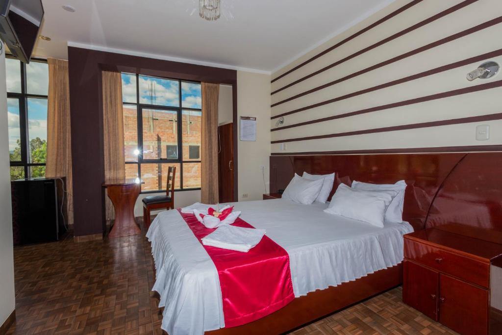 Postel nebo postele na pokoji v ubytování Hotel Suite Naylamp Zyon