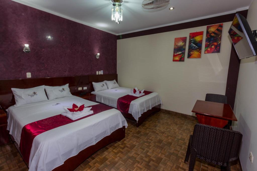 Postel nebo postele na pokoji v ubytování Hotel Suite Naylamp Zyon