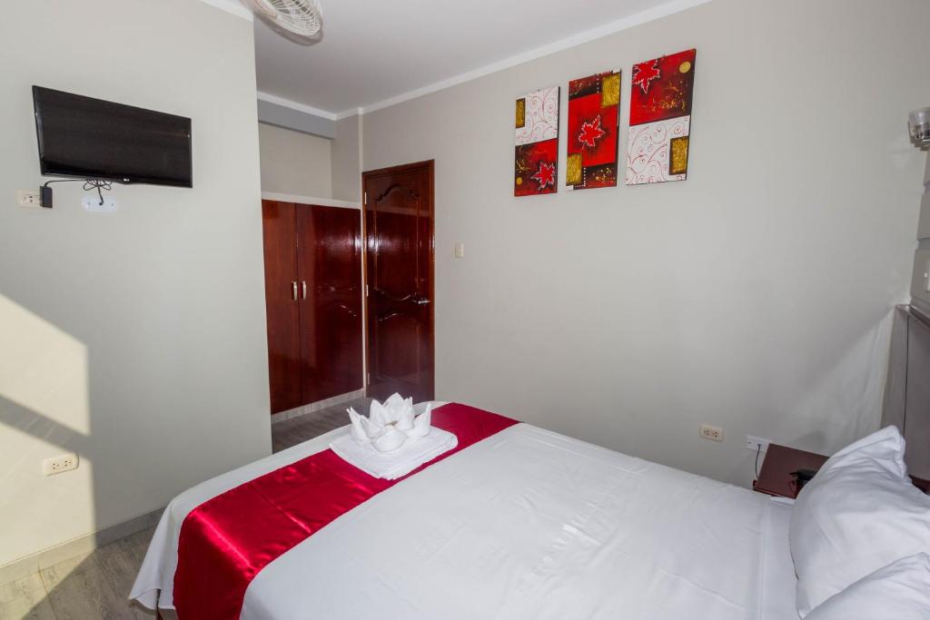Postel nebo postele na pokoji v ubytování Hotel Suite Naylamp Zyon