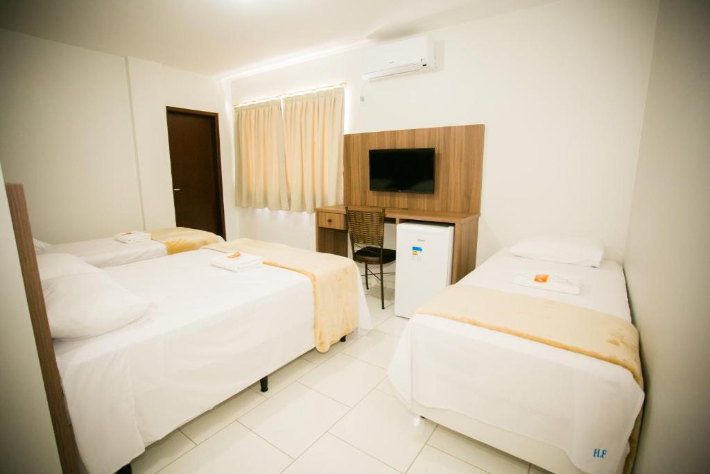 Postel nebo postele na pokoji v ubytování Hotel Folley