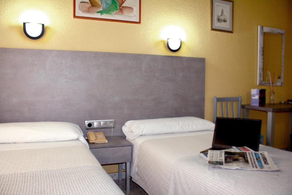 Postel nebo postele na pokoji v ubytování Hotel Universal Murcia