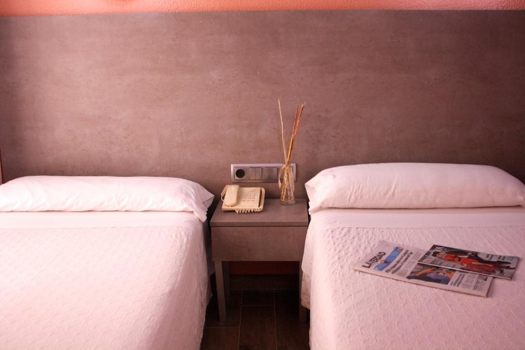 Postel nebo postele na pokoji v ubytování Hotel Universal Murcia