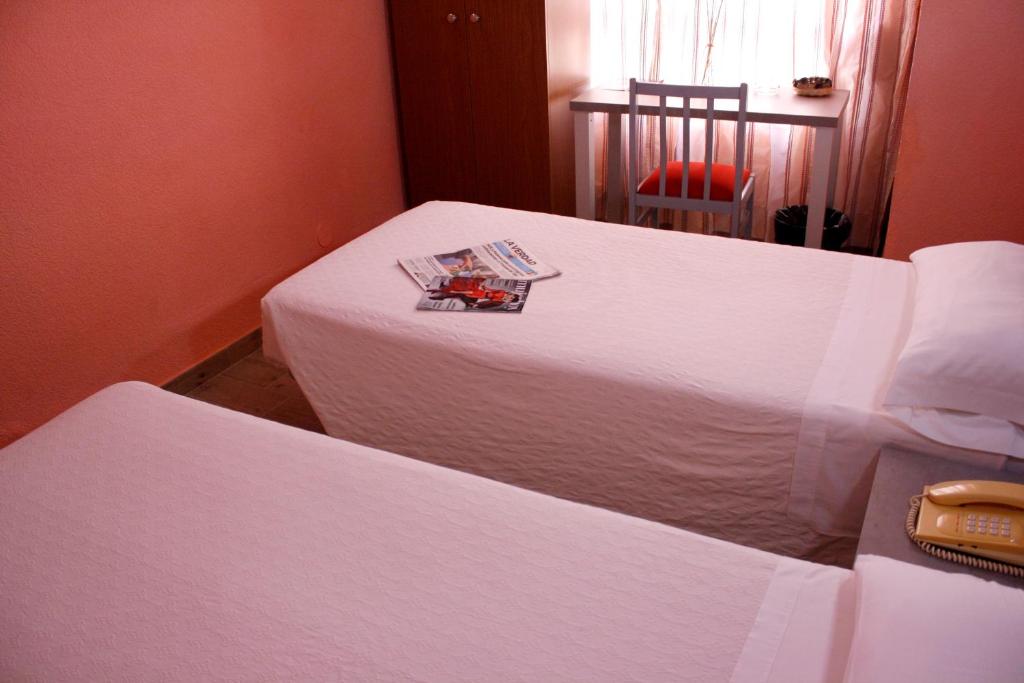 Postel nebo postele na pokoji v ubytování Hotel Universal Murcia