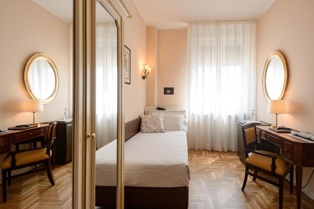 Postel nebo postele na pokoji v ubytování Hotel Continental