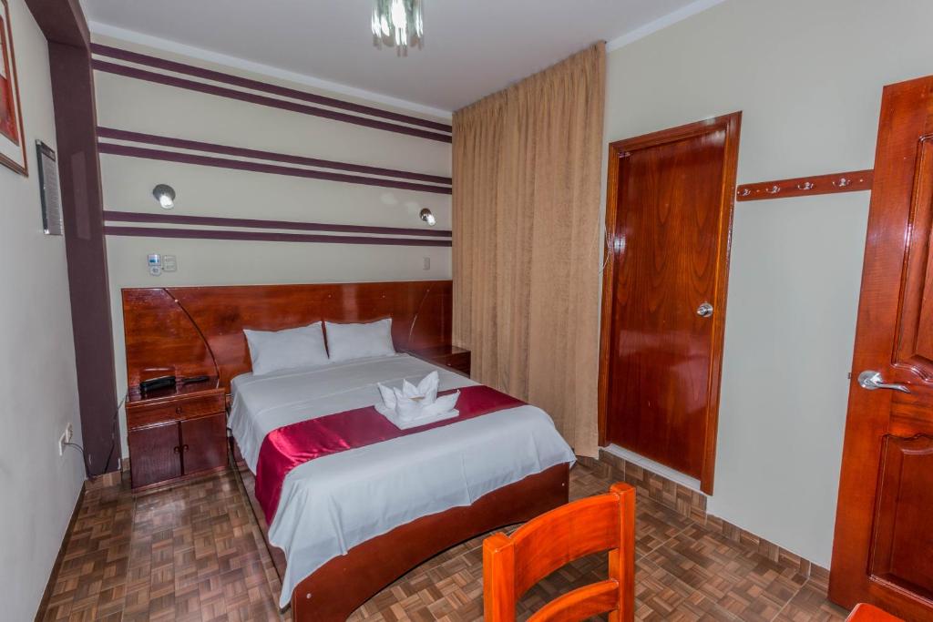 Postel nebo postele na pokoji v ubytování Hotel Suite Naylamp Zyon