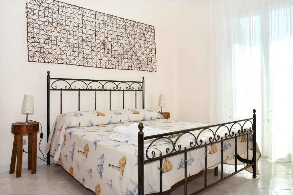 Posteľ alebo postele v izbe v ubytovaní Adriana casa vacanze mare Etna Sicilia