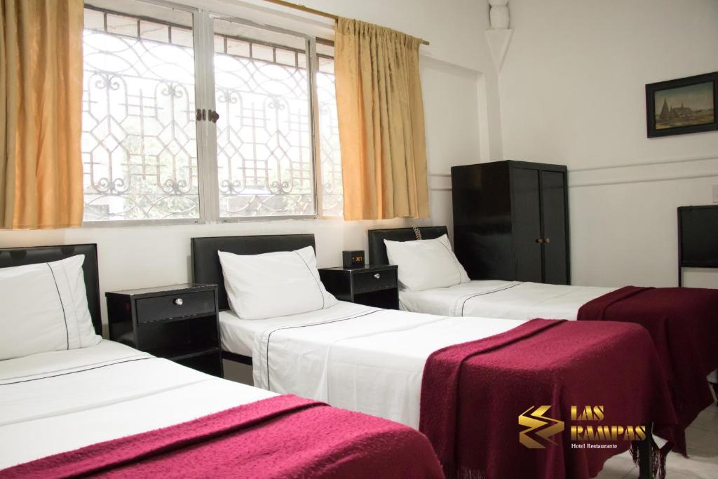 Postel nebo postele na pokoji v ubytování Hotel Las Rampas
