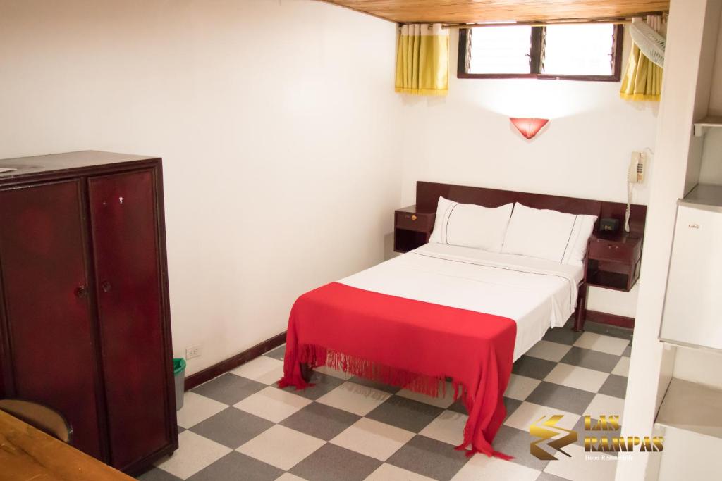 Postel nebo postele na pokoji v ubytování Hotel Las Rampas