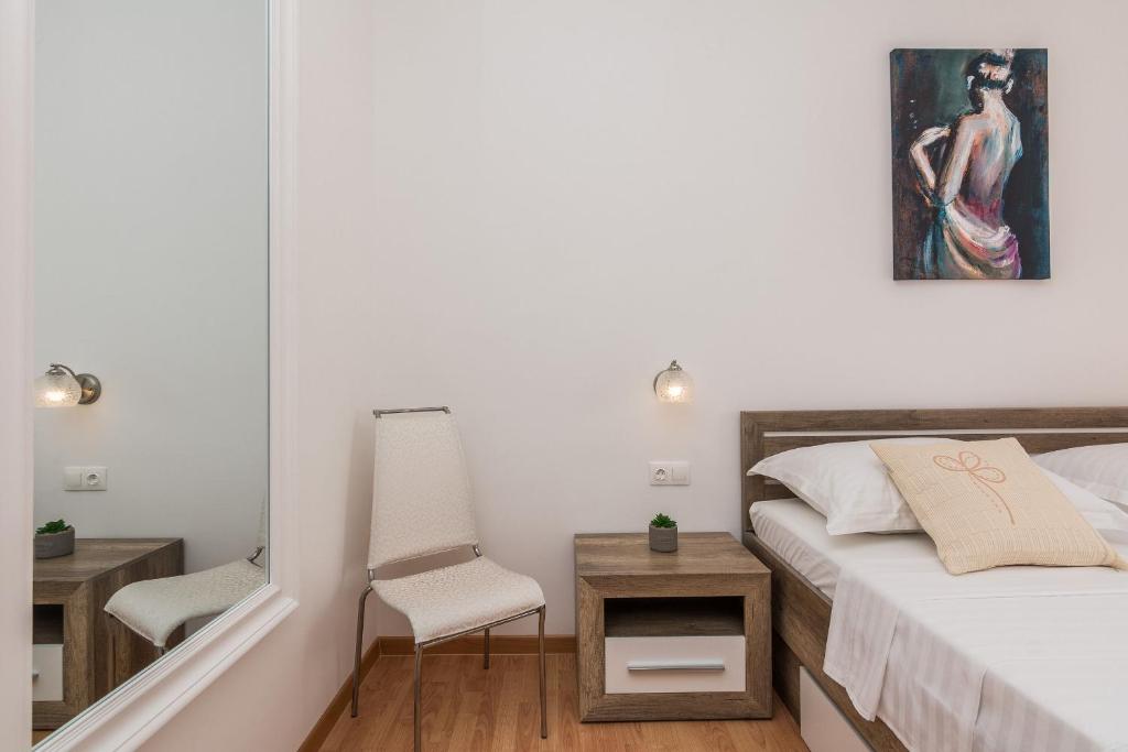 Posteľ alebo postele v izbe v ubytovaní Apartments Hidden Beach Gem