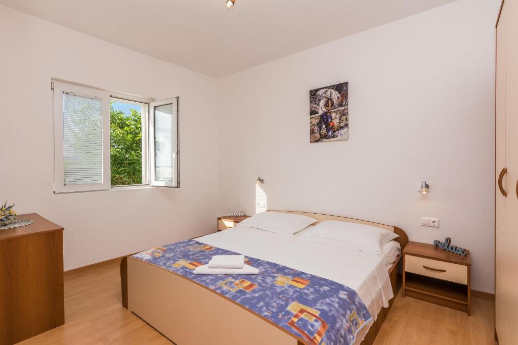 Posteľ alebo postele v izbe v ubytovaní Apartments Hidden Beach Gem